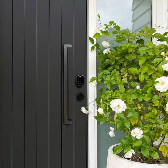 Smart lock installed on a front door, showing how a smart lock works in a real home